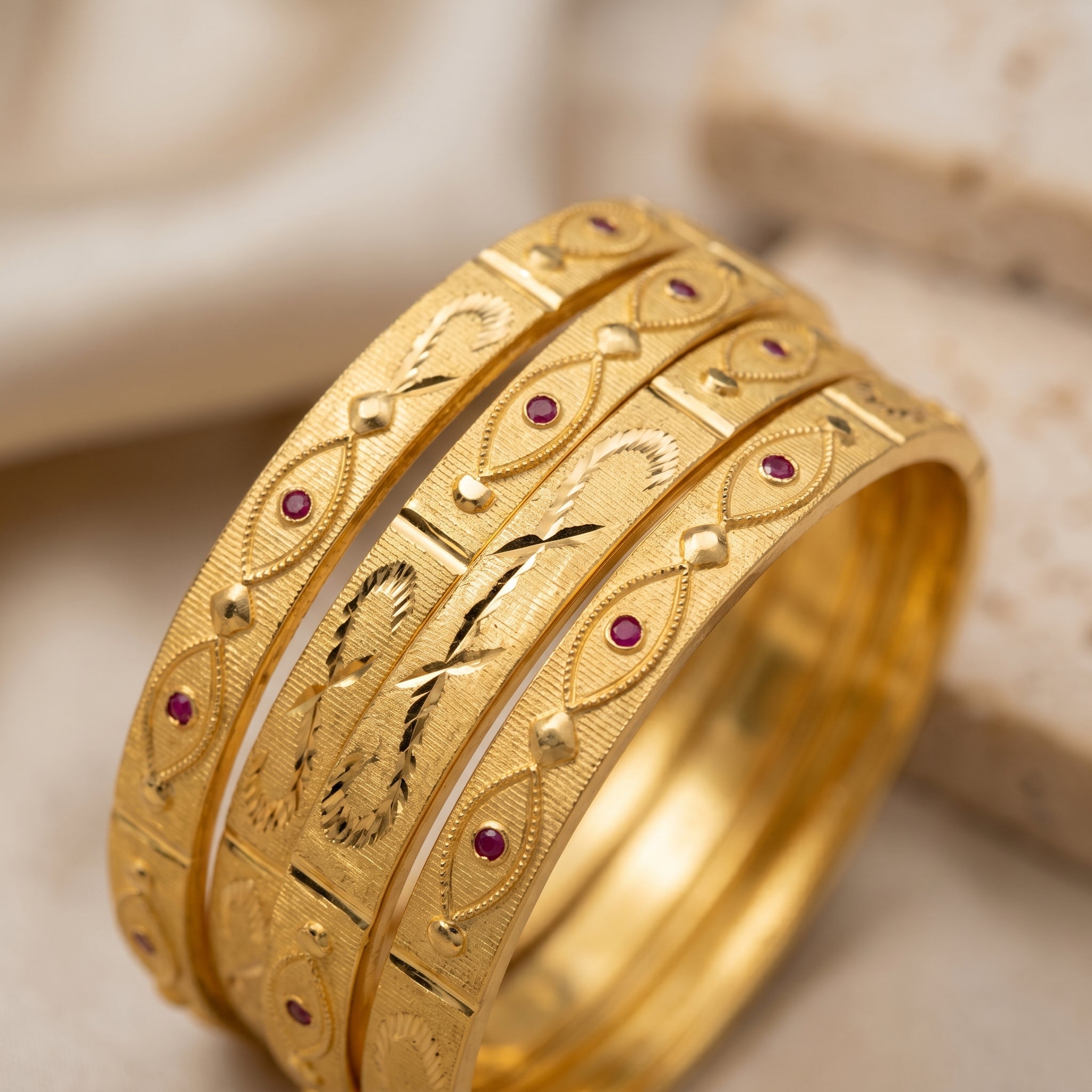 Gold Eye Motif Ruby Stone Engraved Bangle Set of Four