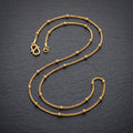Gold Curb Ribbed Ball Station Chain