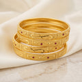 Gold Eye Motif Ruby Stone Engraved Bangle Set of Four