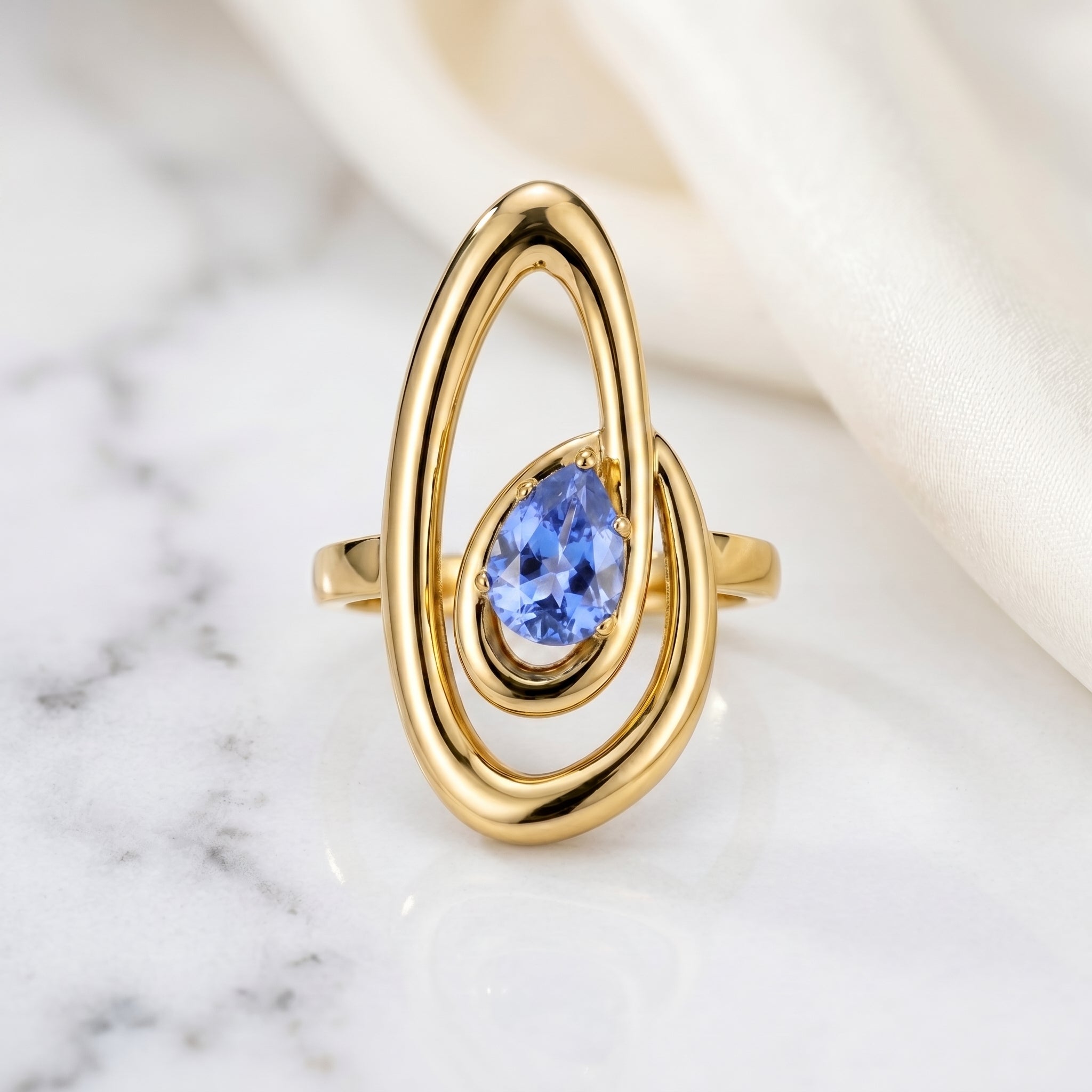Double Orbit Statement Ring with Blue Pear Stone